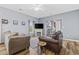 Stylish living room with large windows and comfortable furnishings at 2090 Cross Gate Blvd. # 202, Surfside Beach, SC 29575
