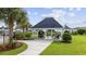 Community pavilion with picnic tables, barbecues, landscaping and walkway at 2090 Cross Gate Blvd. # 202, Surfside Beach, SC 29575