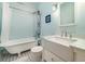 This bathroom features a white clawfoot tub, vintage fixtures, and a pedestal sink at 221 Lander Dr., Conway, SC 29526