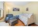 Bright bedroom with hardwood floors, a large window, an accent chair, and beach themed decor at 221 Lander Dr., Conway, SC 29526
