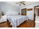 This bedroom features hardwood floors, white wicker furniture, and a ceiling fan with light at 221 Lander Dr., Conway, SC 29526