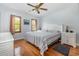 The bedroom has hardwood floors, natural light, and furniture at 221 Lander Dr., Conway, SC 29526