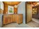 Bright indoor sauna with access to a separate wood paneled room and built in cabinets and countertops at 221 Lander Dr., Conway, SC 29526