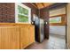 Bright sauna room with brick accent wall, wooden cabinets, tile floors, and access to an additional wood paneled room at 221 Lander Dr., Conway, SC 29526