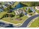 Expansive aerial view of a home with lush landscaping, pond, and cul-de-sac street at 246 Laurel Bay Dr., Murrells Inlet, SC 29576
