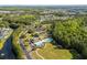 Aerial view of a community featuring a swimming pool, clubhouse, and surrounding greenery at 246 Laurel Bay Dr., Murrells Inlet, SC 29576