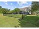 Spacious, fenced in backyard with a screened porch, pond and lush green lawn at 246 Laurel Bay Dr., Murrells Inlet, SC 29576
