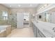 A spacious bathroom with double sinks, soaking tub, and glass-enclosed shower at 246 Laurel Bay Dr., Murrells Inlet, SC 29576