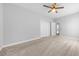 Bedroom with beige carpet, ceiling fan, double closets, and bright sunlight at 246 Laurel Bay Dr., Murrells Inlet, SC 29576