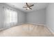 Bedroom with neutral paint, carpet flooring, and a large bright window at 246 Laurel Bay Dr., Murrells Inlet, SC 29576