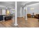 Spacious and inviting living area with hardwood floors, many pillars and a comfortable seating arrangement at 246 Laurel Bay Dr., Murrells Inlet, SC 29576