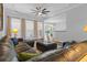 Open-concept living room with natural light, neutral colors, and comfortable seating with a seamless connection to the kitchen at 246 Laurel Bay Dr., Murrells Inlet, SC 29576