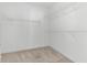 Walk-in closet with shelving for organization and beige carpet flooring at 246 Laurel Bay Dr., Murrells Inlet, SC 29576