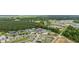 A beautiful aerial view of the community, highlighting the lush greenery and neighborhood pool at 2728 Mercer Dr. # 2728, Conway, SC 29526