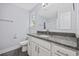 Bathroom features a granite countertop vanity, white cabinets, and a shower with modern fixtures at 2728 Mercer Dr. # 2728, Conway, SC 29526