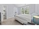 Well-lit bedroom with a large window, featuring light blue walls and neutral carpeting at 2728 Mercer Dr. # 2728, Conway, SC 29526