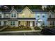 Charming townhomes feature colorful exteriors, landscaped front yards, and convenient parking in front at 2728 Mercer Dr. # 2728, Conway, SC 29526