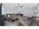 Open living room with wood-look flooring, ceiling fan, comfortable seating, and a dining area at 2728 Mercer Dr. # 2728, Conway, SC 29526