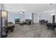 Spacious living room with wood-look flooring, ceiling fan, comfortable seating, and a dining area at 2728 Mercer Dr. # 2728, Conway, SC 29526