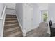 Carpeted staircase leads to a bright area with a door to the exterior at 2728 Mercer Dr. # 2728, Conway, SC 29526
