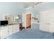 Cozy bedroom with a TV, white dresser, white trim and pastel blue walls at 276 Waterfall Circle, Little River, SC 29566
