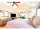 Spacious main bedroom with wood floors, vaulted ceilings, and arched entryways at 276 Waterfall Circle, Little River, SC 29566