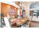 Elegant dining room with a chandelier, decorative wall art, and seating for six guests at 276 Waterfall Circle, Little River, SC 29566