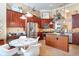 Modern kitchen with an island, stainless appliances, and a bright breakfast nook with a large window at 276 Waterfall Circle, Little River, SC 29566