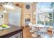 Updated kitchen features stainless appliances, granite countertops and an eat-in area with large windows at 276 Waterfall Circle, Little River, SC 29566