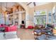 Spacious living room with a fireplace, tile floors, and comfortable seating areas at 276 Waterfall Circle, Little River, SC 29566