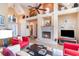 Open living space with fireplace, high ceilings, and views into the dining and sitting area at 276 Waterfall Circle, Little River, SC 29566