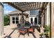 Outdoor patio with a pergola, brick floor, and backyard view at 276 Waterfall Circle, Little River, SC 29566