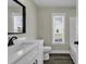 Bright bathroom featuring modern vanity with quartz countertop, stylish black faucet, and sleek design at 2919 Hughes Gasque Rd., Aynor, SC 29511