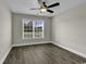 Bedroom with hardwood floors, large window, and ceiling fan at 2919 Hughes Gasque Rd., Aynor, SC 29511