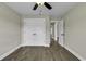 Cozy bedroom featuring hardwood floors, closet space, ceiling fan, and natural light at 2919 Hughes Gasque Rd., Aynor, SC 29511