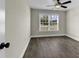 Bright bedroom featuring hardwood floors, large window, and neutral colored walls at 2919 Hughes Gasque Rd., Aynor, SC 29511