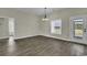 Bright dining area featuring hardwood floors, modern lighting and a door to the outside at 2919 Hughes Gasque Rd., Aynor, SC 29511