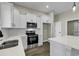 Well-equipped kitchen with stainless steel appliances, ample white cabinetry, and a center island at 2919 Hughes Gasque Rd., Aynor, SC 29511