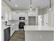 Well-equipped kitchen with stainless steel appliances, ample white cabinetry, and a center island at 2919 Hughes Gasque Rd., Aynor, SC 29511