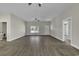 Open concept living area with hardwood floors, neutral walls, and natural light at 2919 Hughes Gasque Rd., Aynor, SC 29511