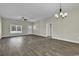Spacious living room featuring hardwood floors, neutral walls, and a modern ceiling fan at 2919 Hughes Gasque Rd., Aynor, SC 29511