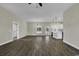 Bright living room with an open layout that flows seamlessly into a modern kitchen with stainless appliances at 2919 Hughes Gasque Rd., Aynor, SC 29511