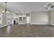 Open concept living area with hardwood floors and a modern kitchen with white cabinets at 2919 Hughes Gasque Rd., Aynor, SC 29511