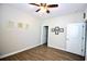 This is a clean, bright bedroom with wood floors, ceiling fan, and decorative wall art at 3024 Calusa Dr., Little River, SC 29566