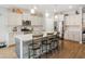 Spacious kitchen with a large island, granite countertops, stainless steel appliances, and ample cabinet space at 3024 Calusa Dr., Little River, SC 29566