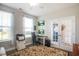 Home office with plush beige sofa, hardwood floors, lots of natural light, and double doors at 3024 Calusa Dr., Little River, SC 29566