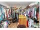 Walk-in closet with custom shelving, hardwood floors, and ample storage space at 3024 Calusa Dr., Little River, SC 29566