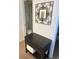 Bathroom area featuring black accent table with a decorative mirror above and a stack of fresh towels at 310 N 73Rd Ave. N # 5D, Myrtle Beach, SC 29572