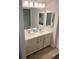 Bathroom featuring a double sink vanity with ample counter space and a large mirror at 310 N 73Rd Ave. N # 5D, Myrtle Beach, SC 29572