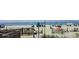 Beautiful beach scene with a lifeguard chair, the boardwalk, and colorful umbrellas at 310 N 73Rd Ave. N # 5D, Myrtle Beach, SC 29572